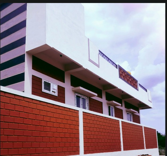 Modern two-storey residence with red exposed interlocking block compound wall and exterior wall cladding
